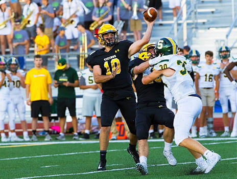 CJ Callaghan throwing football.