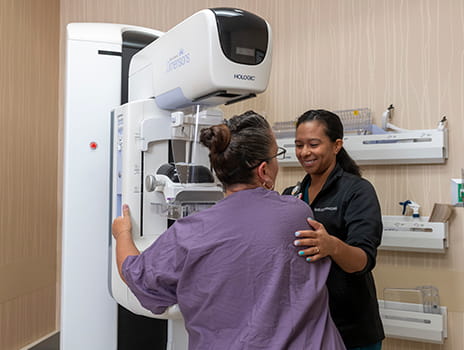 Patient receiving a mammogram