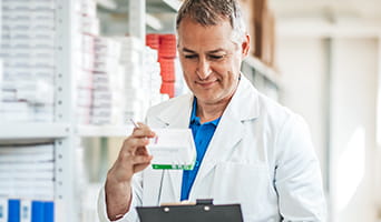 A pharmacist examing a prescription