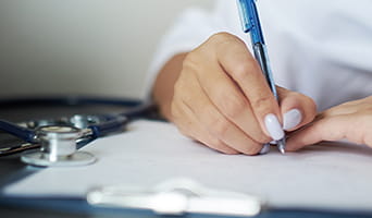 A doctor writing